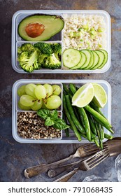 Vegan Green Meal Prep Containers With Quinoa, Rice, Avocado And Vegetables