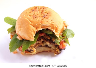 Vegan Hamburger With A Bite On A White Background