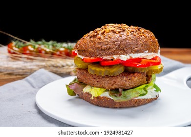 Vegan Hamburgers With Grilled Healthy Plant Based, Meat Free Burgers And Fresh Vegetables