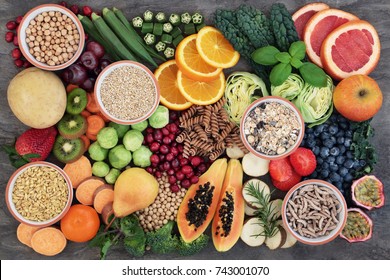 Vegan health food concept for  high fibre diet with fruit, vegetables, cereals, whole wheat pasta, grains, legumes, herbs. Foods high in antioxidants  and vitamins. Immune system boosting. Flat lay.