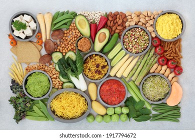 Vegan health food for a plant based diet with a large collection of food high in antioxidants, protein, minerals, fibre, anthocyanins, vitamins, lycopene, omega 3  smart carbs. Healthy eating concept.