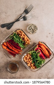 Vegan Healthy Meal Prep Containers. Chickpeas, Sweet Potatoes, Arugula, Radish, Avocado And Sauce For Lunch On Concrete Background. Vegan, Healthy, Detox Food Concept. Top View