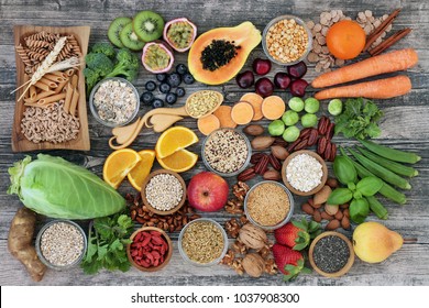Vegan high dietary fibre and immune boosting health food  with fruit, vegetables, whole wheat pasta, legumes, cereals, nuts and seeds with foods high in omega 3, antioxidants, anthocyanins, vitamins.