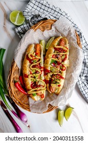 Vegan Hot Dogs In A Basket, Hot Dog With Ketchup  Mustard Red Onion And  Chilli, Overhead Scene, Food Photography On A Marble Background, 