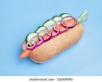 Vegan Hotdog With Carrot On Blue Background