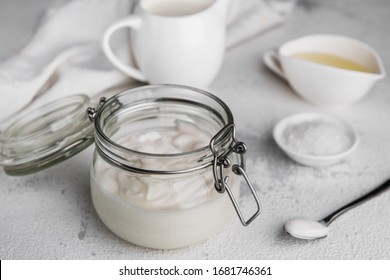 Vegan Mayonnaise In A Glass Jar On A Light Background