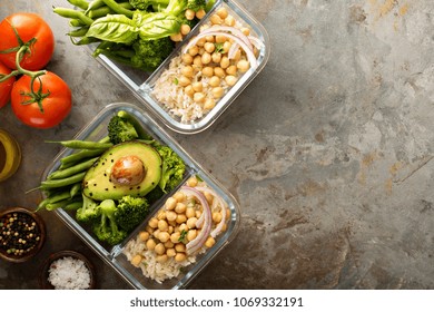 Vegan Meal Prep Containers With Cooked Rice, Chickpeas And Vegetables