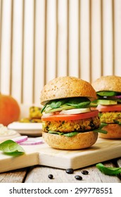 Vegan Millet Black Bean Pumpkin Burgers On A White Wood Background. The Toning. Selective Focus