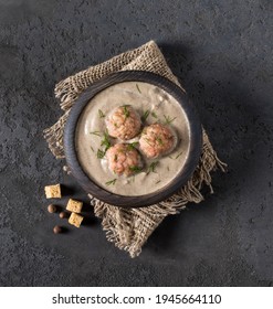 Vegan Mushroom Soup Puree With Meatballs, Dill And Croutons In A Wooden Bowl On A Linen Napkin On A Dark Background In Rustic Style Top View