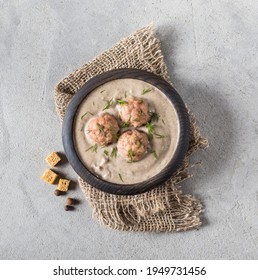 Vegan Mushroom Soup Puree With Meatballs, Dill And Croutons In A Wooden Bowl On A Linen Napkin On A Light Gray Background In Rustic Style Top View