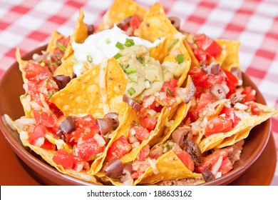 Vegan Nachos With Tomatoes, Black Beans, Corn, Olives, Avocado And Scallion