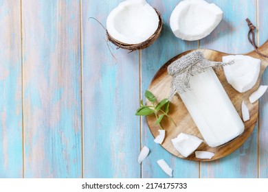 Vegan non dairy alternative milk, health content. Organic coconut milk in a bottle on a rustic table. View from above. Copy space.