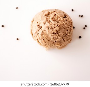 Vegan Oat Milk Ice Cream Ball With Chocolate Chips On A Light Background With Space For Text. Top View. Flat Lay