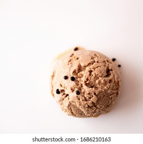 Vegan Oat Milk Ice Cream Ball With Chocolate Chips On A Light Background With Space For Text.Top View. Flat Lay