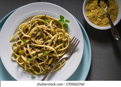 Vegan Pasta, Fettuccine With Pesto Sauce, Green Olives And Red Pepper. Directly Above Shot.