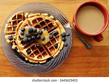 Vegan, Plant Based Waffles With Applesauce, Blueberries, And Canadian Maple Syrup