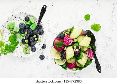 Vegan power bowl. Vegetables fruits green leafy vegetables for a healthy snack. Top View - Powered by Shutterstock