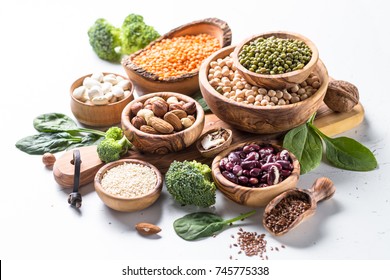 Vegan Protein Source. Beans, Lentils, Nuts, Broccoli Spinach And Seeds On White. Healthy Vegetarian Food.