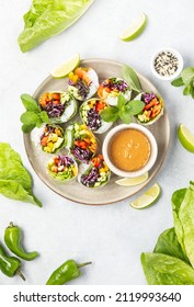 Vegan Rainbow-colored Spring Rolls Served With Peanut Sauce, Top Down View