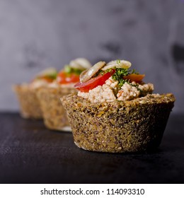 Vegan Raw Food Quiche With Nut Filling And Vegetables On Top