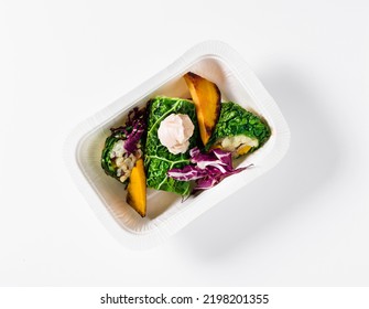 Vegan Restaurant Dish: Savoy Cabbage Rolls With Rice And Baked Vegetables: Pumpkin, Radish  And Mayonnaise In A Plastic Takeout Container