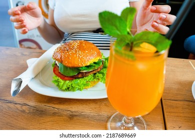 Vegan Sandwich Healthy Vegetarian Burger. Cute Cheerful Girl Eating Veggie Hamburger With Salad, Avocado, Vegetable. Vegetarian Diet Food Concept