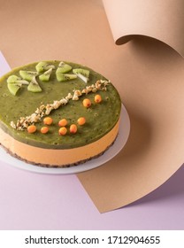 Vegan Sea Buckthorn And Kiwi Raw Cake On Paper Background. Minimalist Food Photography. 