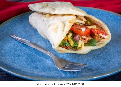 Vegan Shawarma (no Lamb) Wrap,  Kebab On A Turquoise Plate With A Fork