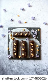 Vegan Snickers Raw Bars On Black Plate