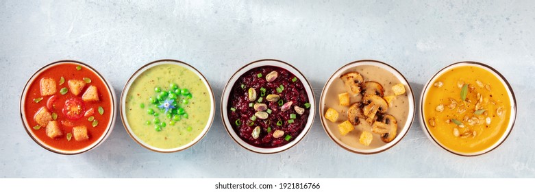 Vegan soup panorama with copy space. An assortment of vegetable cream soups