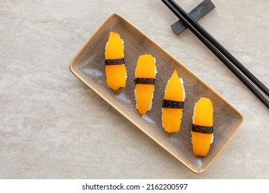 Vegan Sushi Nigiri With Golden Tomato Instead Of Salmon Fish. Top View.