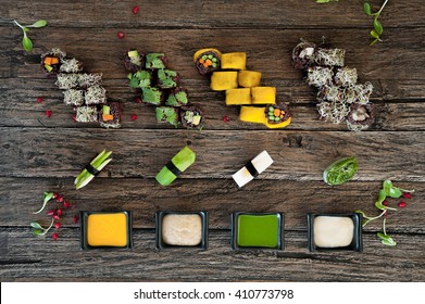 Vegan Sushi  Set With Different Types Of Sauce On Wooden Table. Top View.