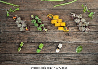 Vegan Sushi  Set With Different Types Of Sauce On Wooden Table. Top View.