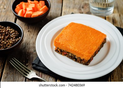 Vegan Sweet Potato Shepherd's Pie On A Wood Background. Toning. Selective Focus