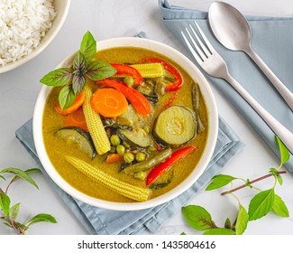 Vegan Thai Green Curry With Rice, Garnished With Thai Basil, Directly Above Photo. Traditional Thai Food Photography