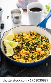 Vegan Tofu Scramble With Spinach And Carrots For Breakfast With Coffee On White Table