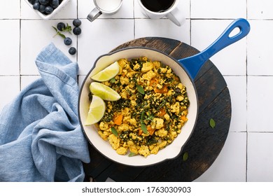 Vegan Tofu Scramble With Spinach And Carrots For Breakfast With Coffee On White Table