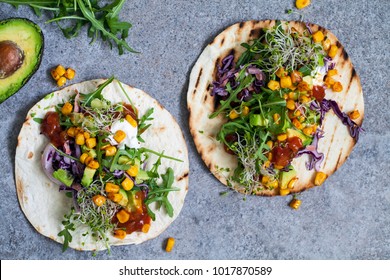 Vegan tortillas with sweetcorn, avocado, red cabbage and broccoli sprouts
