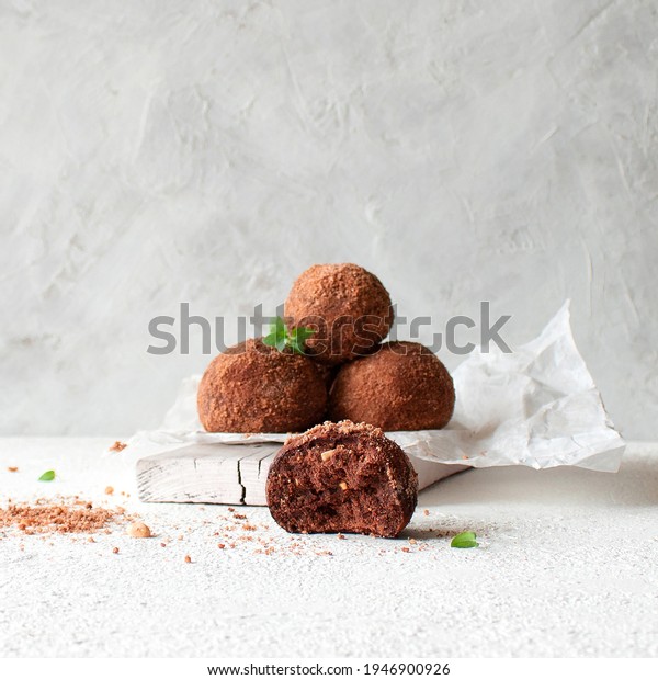 Vegan truffle. Chocolate Potato Cake\
on white paper on a light background with space for\
text.