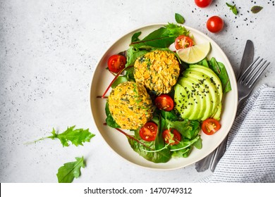 Vegan vegetable burgers with salad in a white plate, copy space. - Shutterstock ID 1470749312