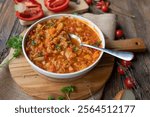 Vegan vegetable soup with cabbage and red lentils on a plate