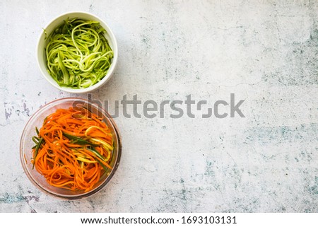 Vegan vegetables salad. Korean spicy carrot salad and zucchini spaghetti. Healthy food. Copy space.