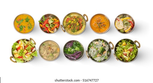 Vegan Or Vegetarian Restaurant Dishes Top View, Hot Spicy Indian Soups, Rice And Salads In Copper Bowls. Traditional Indian Cuisine Meal Assortment Isolated On White Background. Healthy Eastern Food