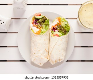 Vegan Wrap, Top Down View - Beautifully Arranged And Surved On A White Wooden Table	
