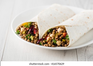 Vegan Wraps With Lentil, Chickpea, Kidney Bean, Peppers And Hummus Sauce