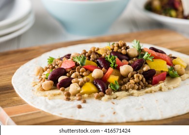 Vegan Wraps With Lentil, Chickpea, Kidney Bean, Peppers And Hummus Sauce