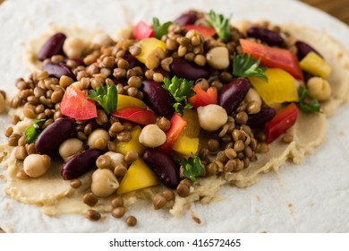 Vegan Wraps With Lentil, Chickpea, Kidney Bean, Peppers And Hummus Sauce