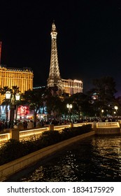 Vegas, Nevada, United States. February 23, 2020: Eiffel tower illuminated at night and reflection of lights in the water.