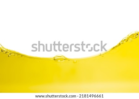 Vegatable oil surface, bubbles and  wave isolated on white background.