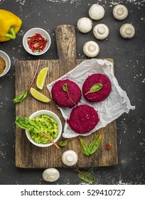 Vegetable Beetroot Patties Before Cooking With Various Vegetables, Mushrooms, Avocado Guacamole And Herbs To A Veggie Burger. Concept Of Healthy Organic Food. Top View